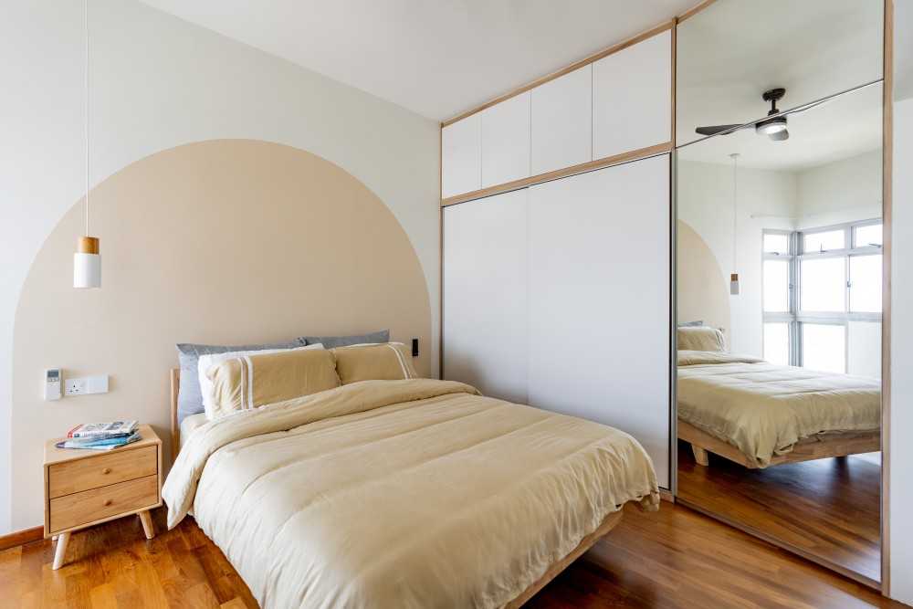 Minimalist Bedroom with Wood Flooring and Artwork