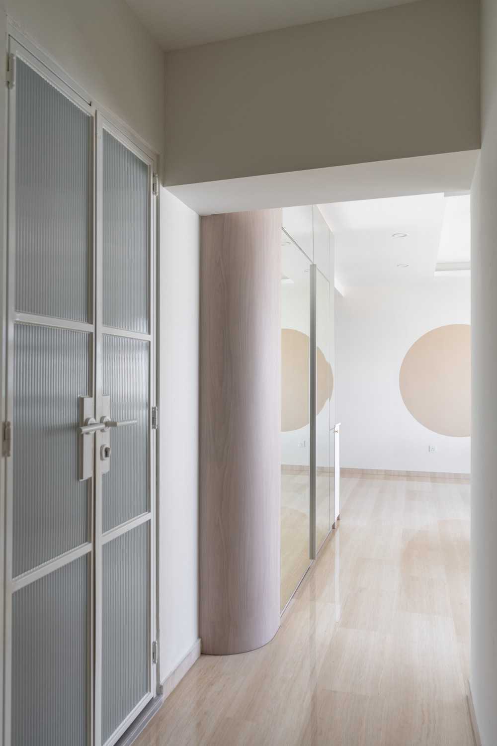 Minimalist Hallway with Vinyl Flooring and Storage Cabinets
