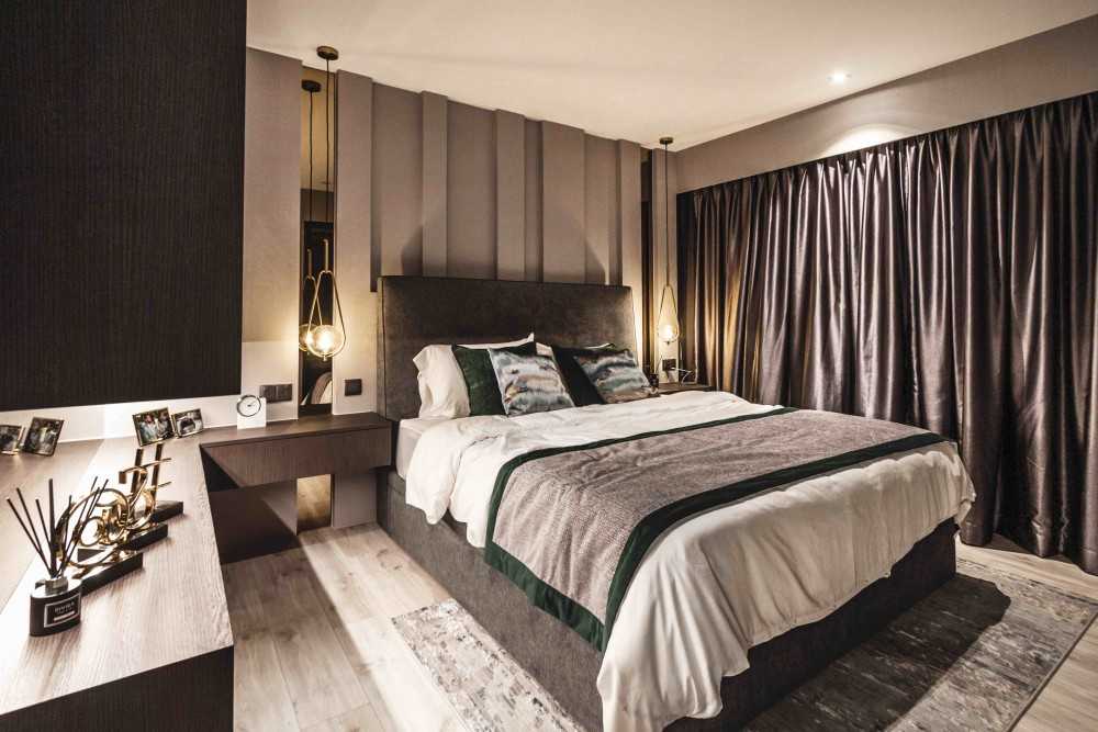 Modern Bedroom with Cove Lighting and Bedside Table