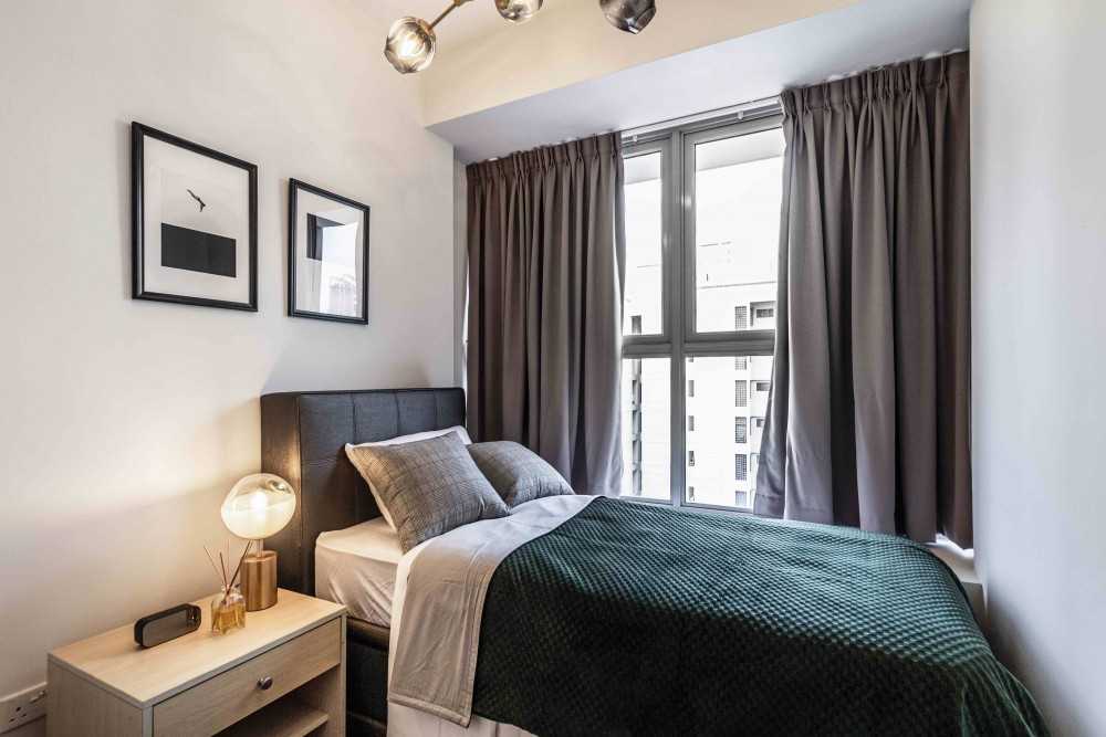 Contemporary Bedroom with Bay Window and Bedside Table