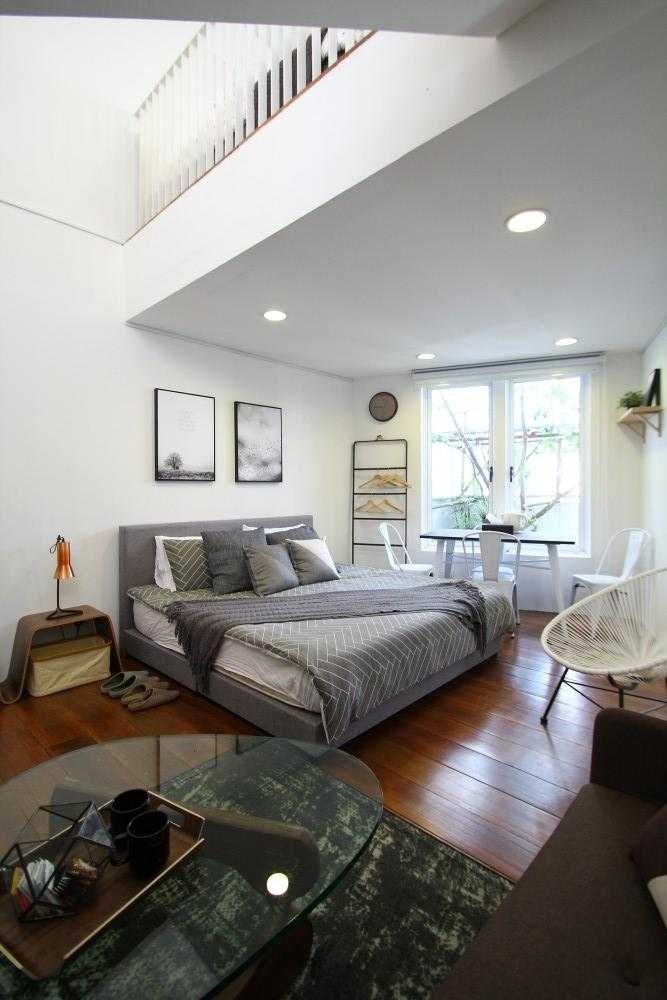 Scandinavian Bedroom with Cove Lighting and Ceiling Light