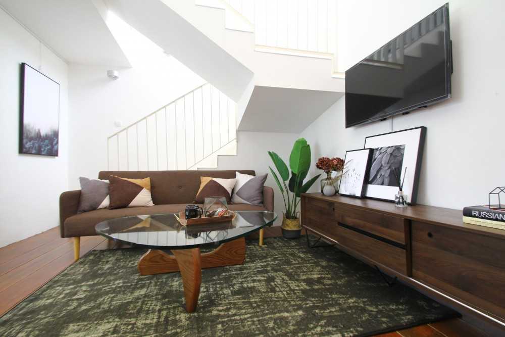 Scandinavian Living Room with TV Console and Cove Lighting