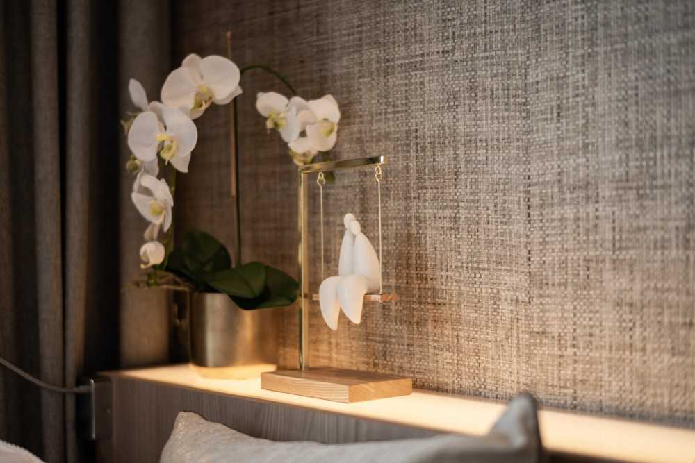 Contemporary Bedroom with Cove Lighting and Bedside Table