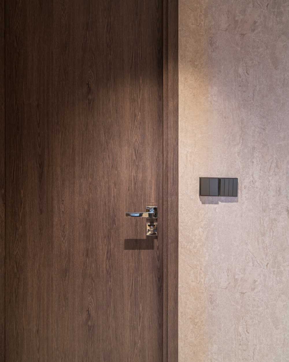 Contemporary Hallway with Bookshelf and Artwork