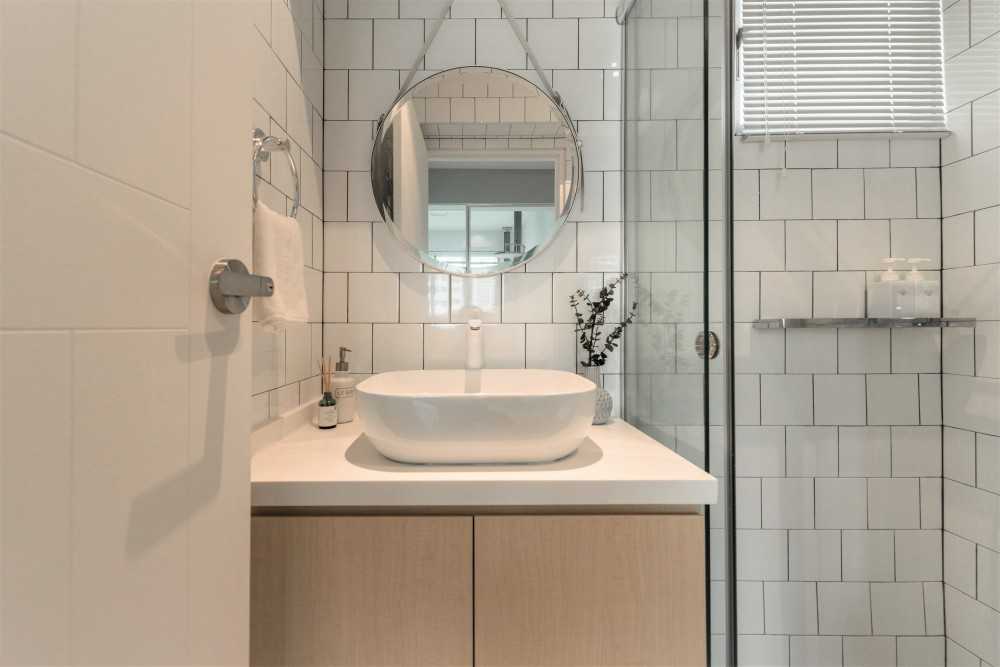 Scandinavian Bathroom with Countertop and Mirror