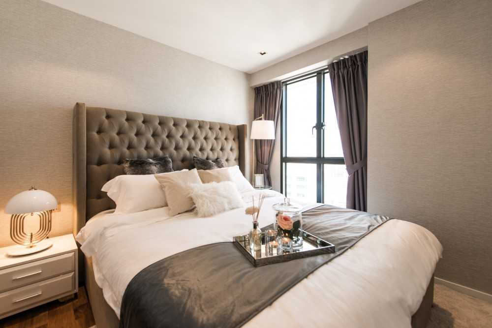 Contemporary Bedroom with Cove Lighting and Bedside Table