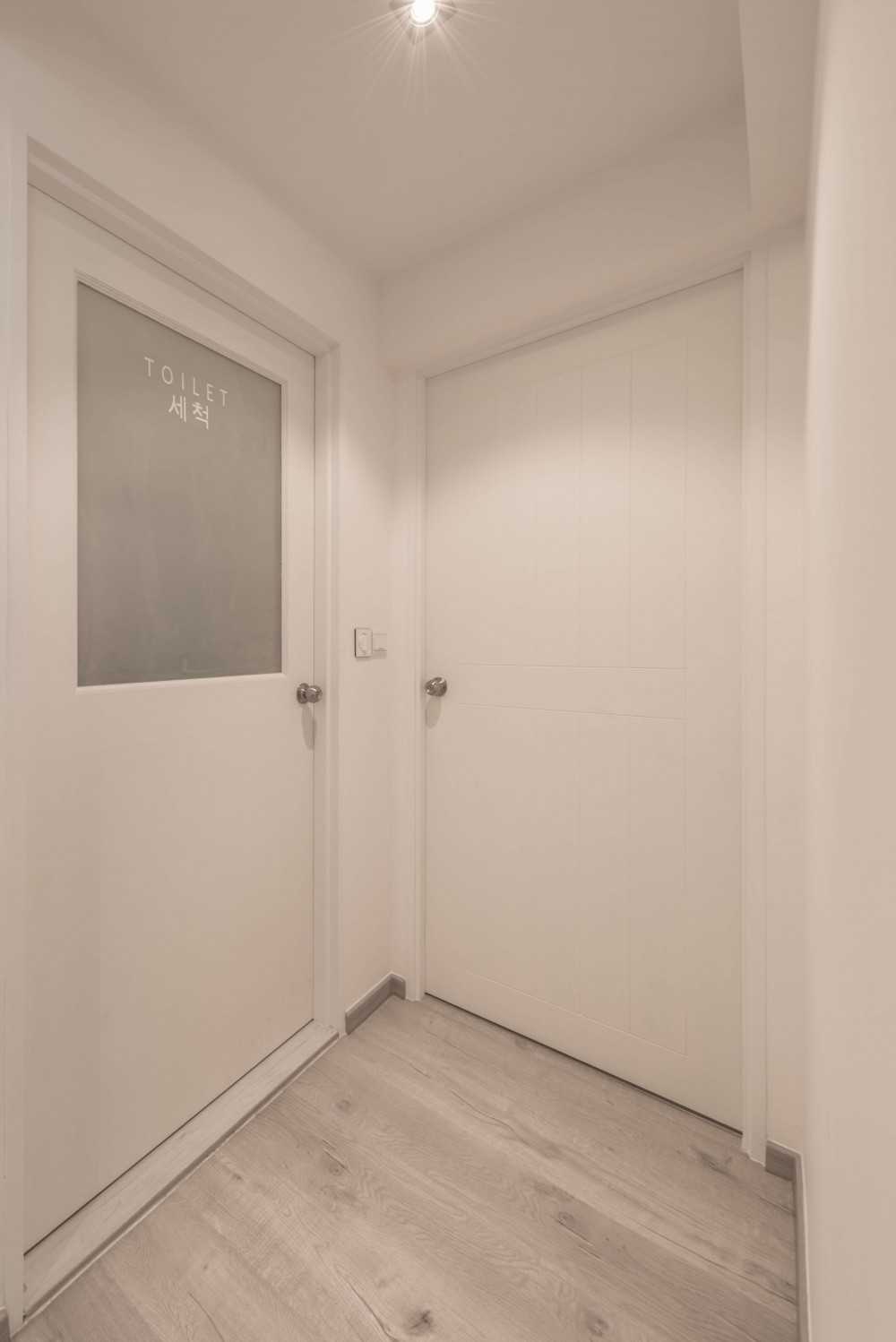 Scandinavian Hallway with Bookshelf and Artwork