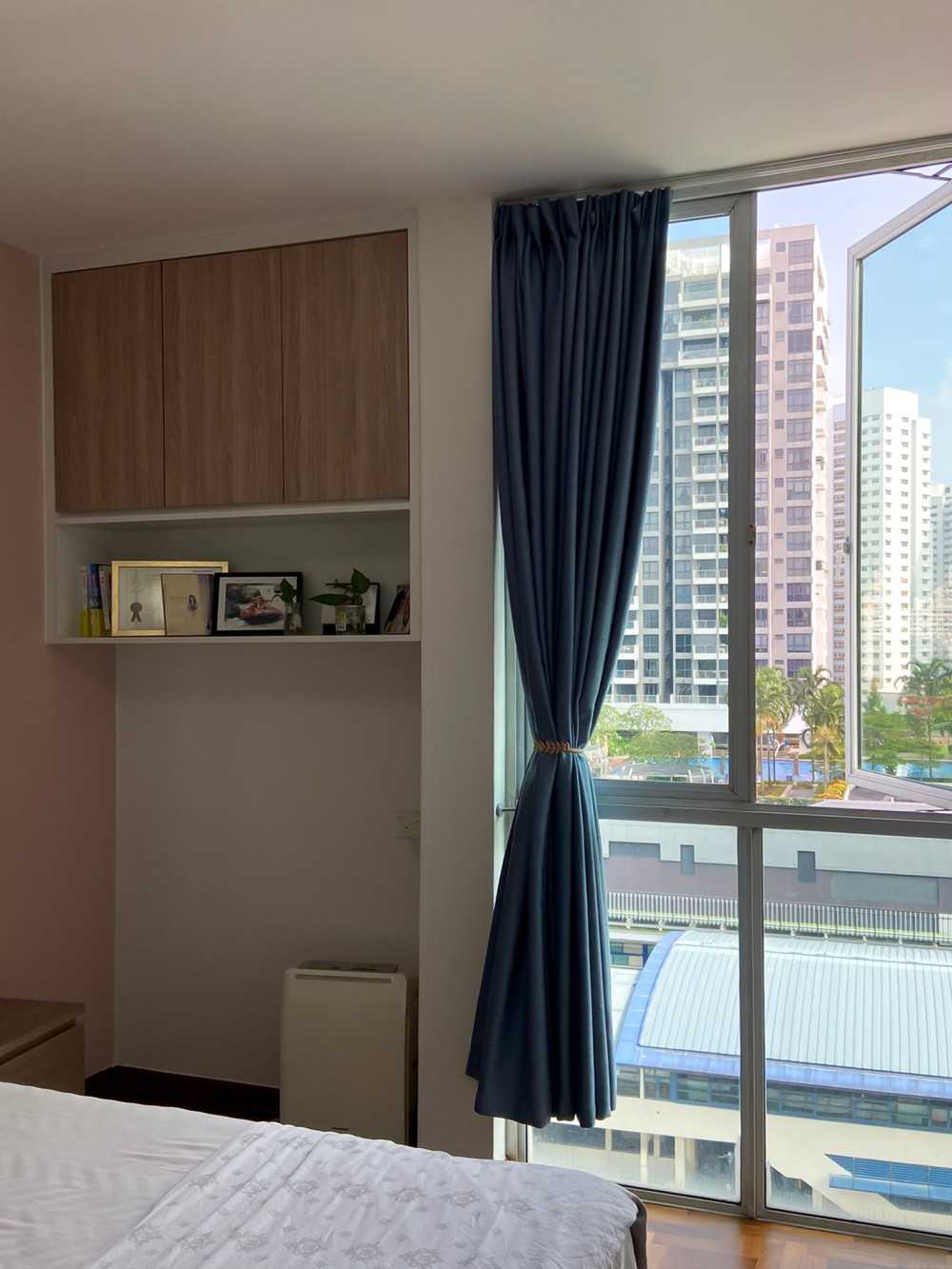Modern Bedroom with Bookshelf and Window Grille