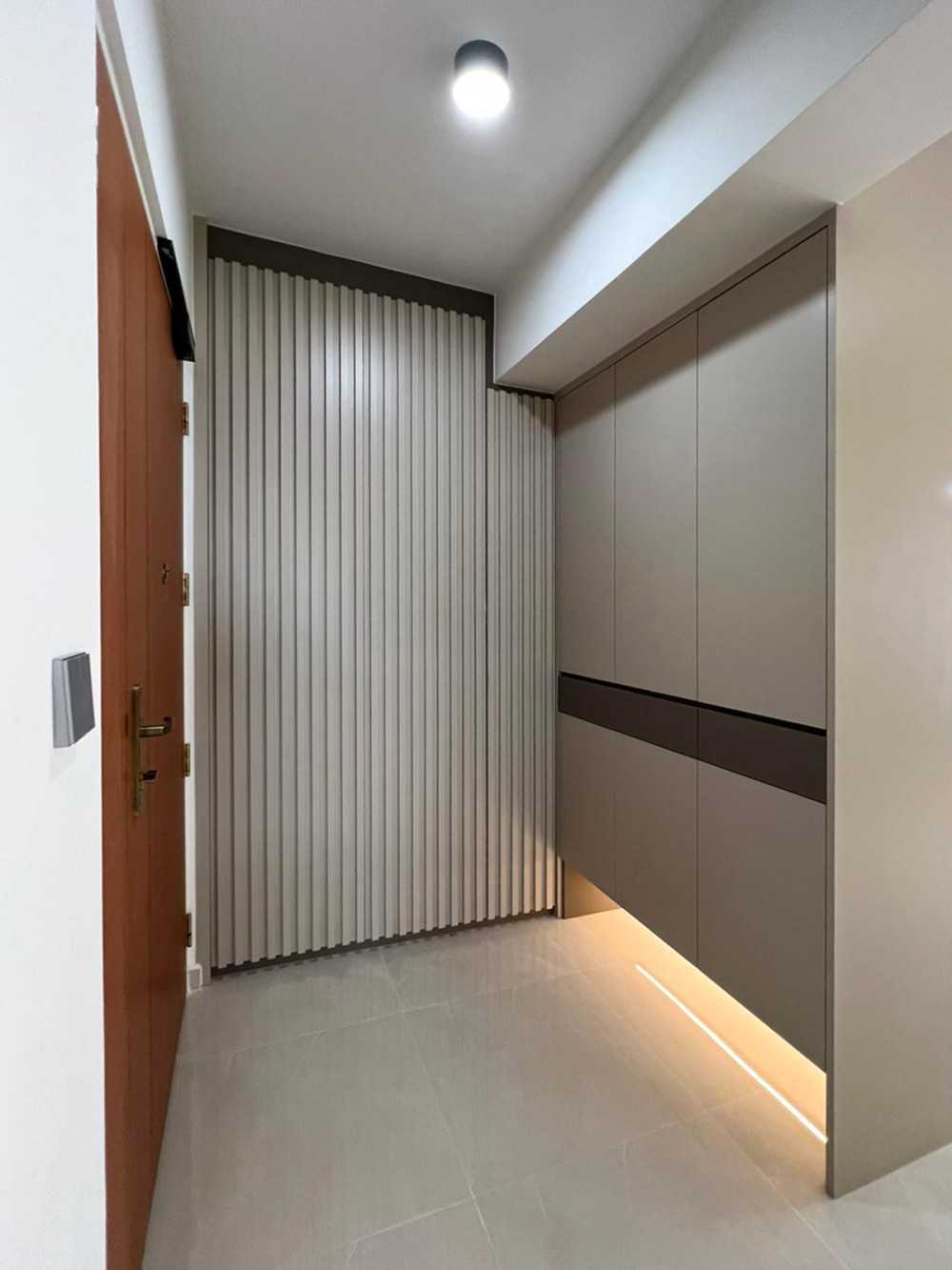Scandinavian Foyer with Paintings and Storage Cabinets