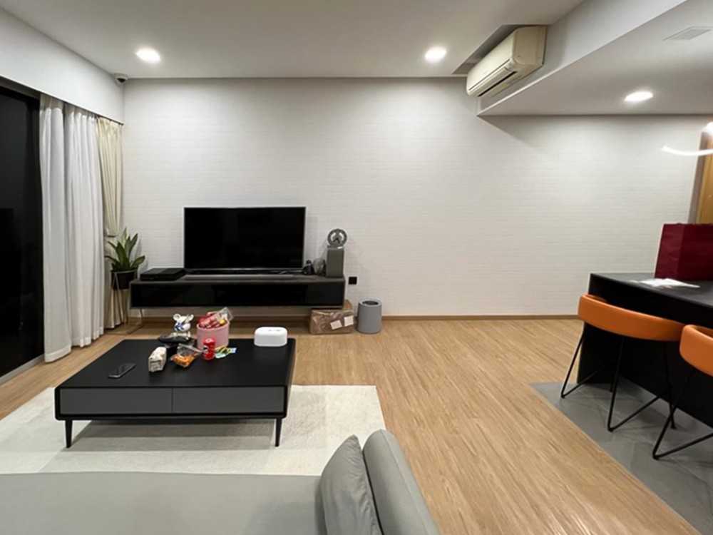 Scandinavian Living Room with TV Console and Paintings