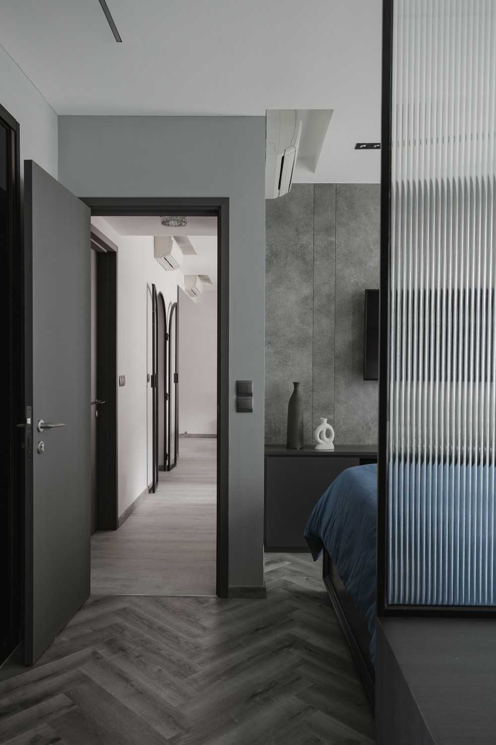 Modern Bedroom with Herringbone Tiling and TV Console
