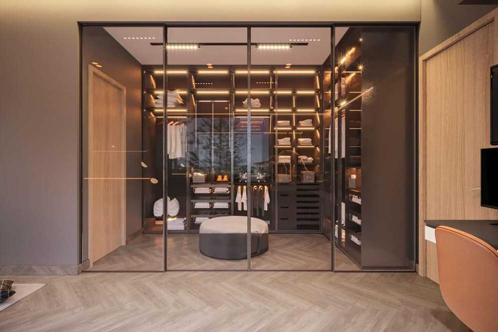 Contemporary Walk-in Wardrobe with Herringbone Tiling and Drop Light