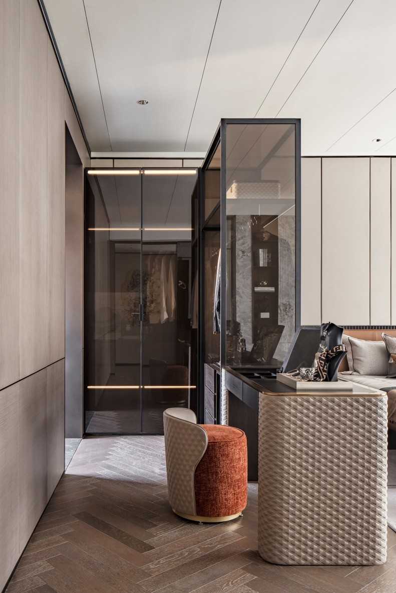 Contemporary Walk-in Wardrobe with Herringbone Tiling and Feature Wall