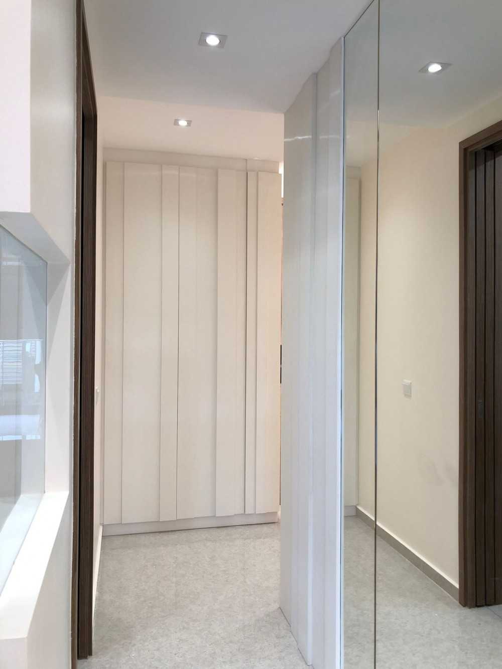 Modern Foyer with Mirror and Paintings