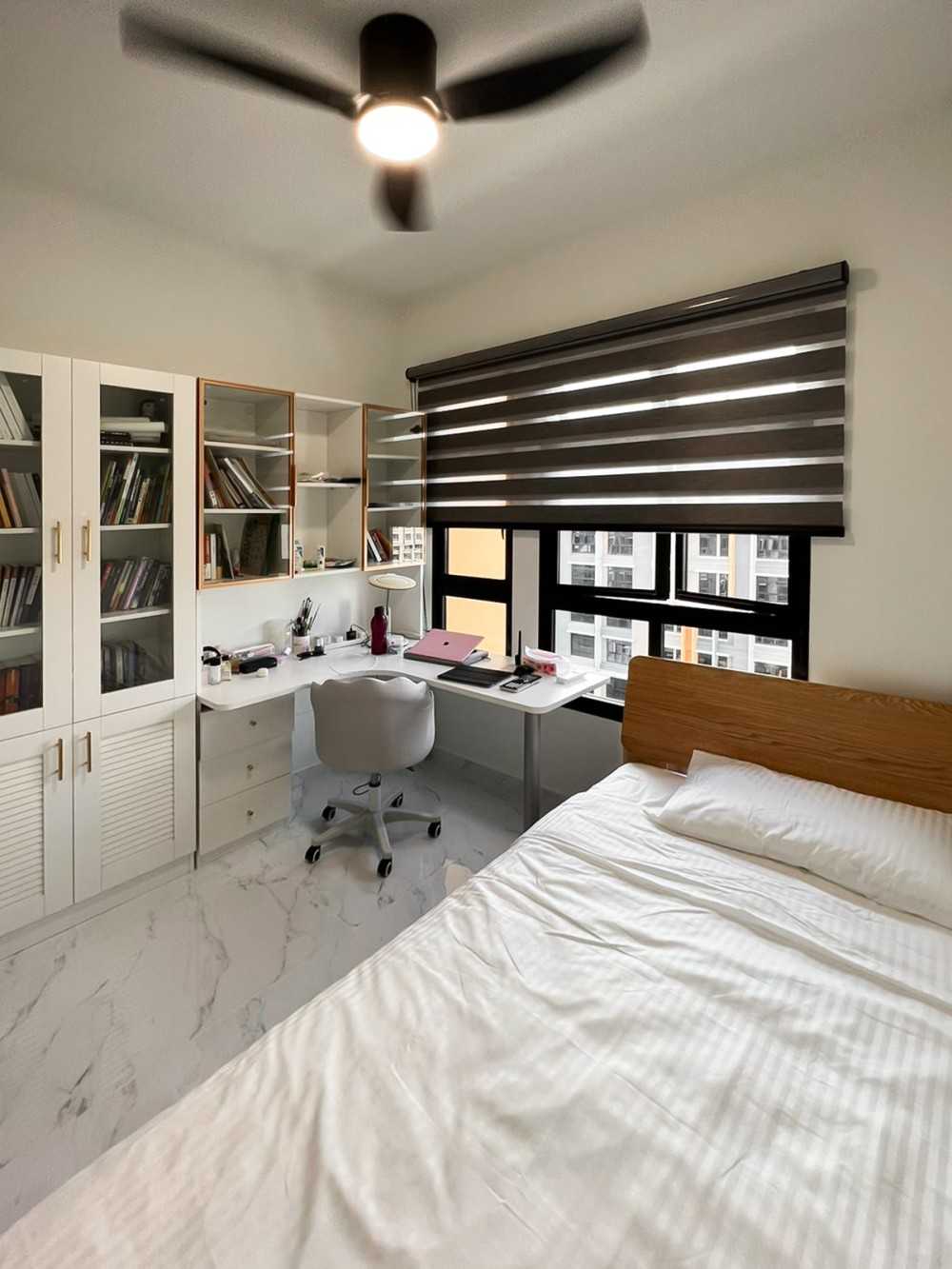 Modern Bedroom with Bookshelf and Window Grille