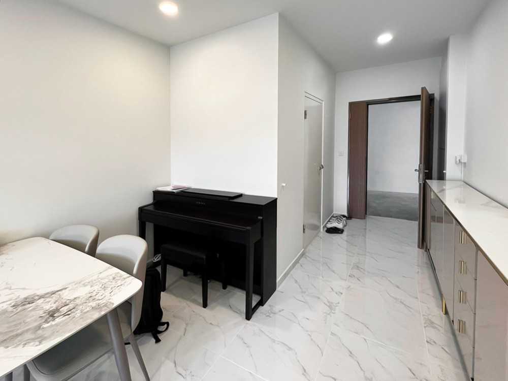 Modern Foyer with Paintings and Storage Cabinets