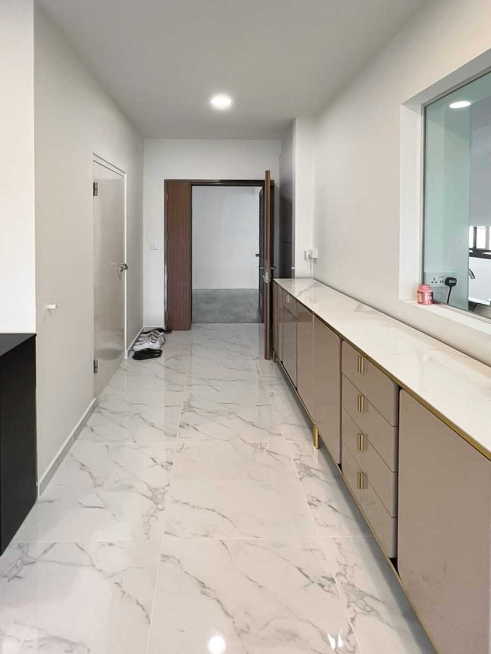 Modern Foyer with Kitchen Window and Paintings