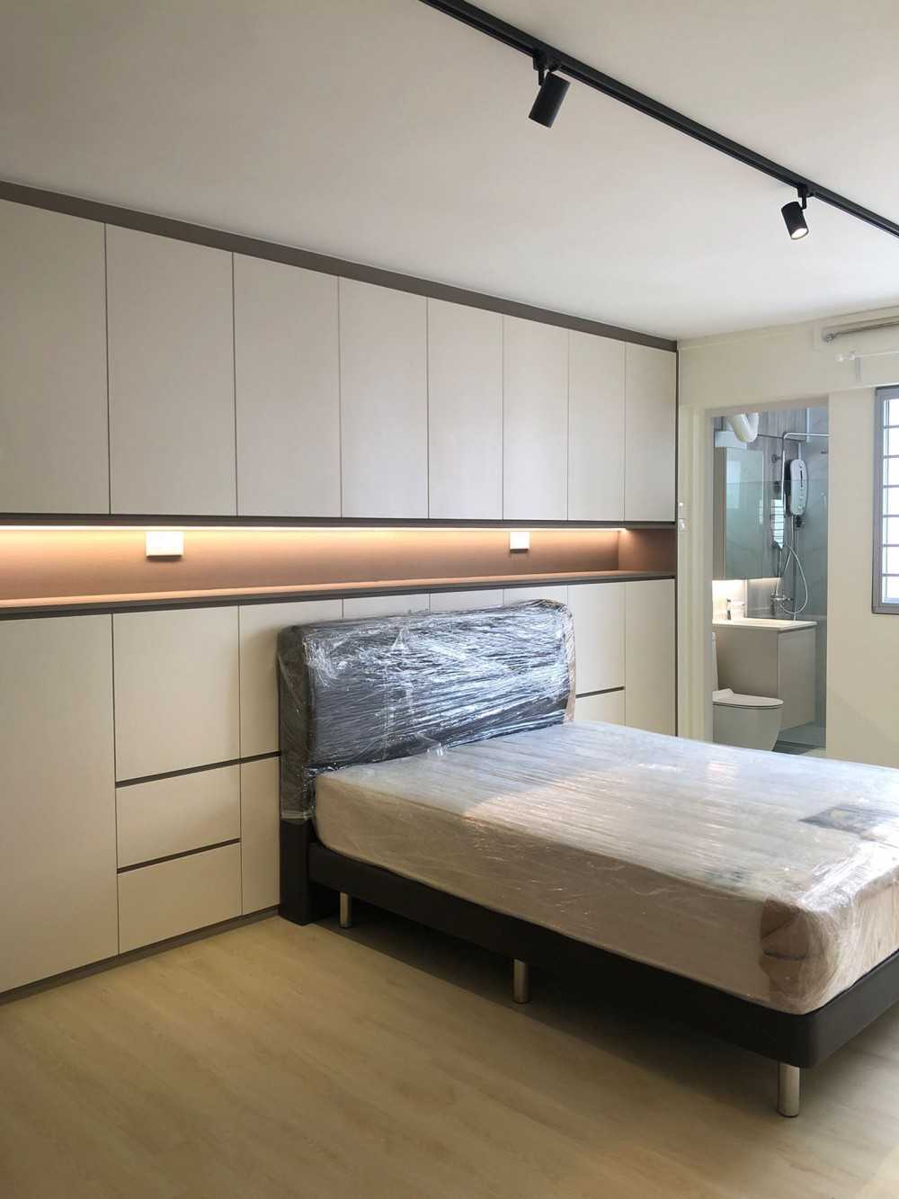 Scandinavian Bedroom with Paintings and Storage Cabinets