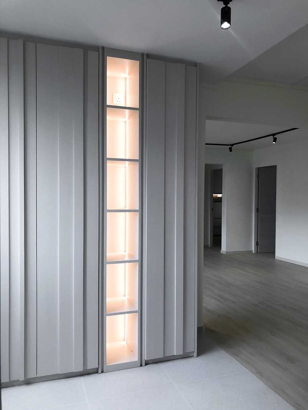 Scandinavian Foyer with Paintings and Storage Cabinets