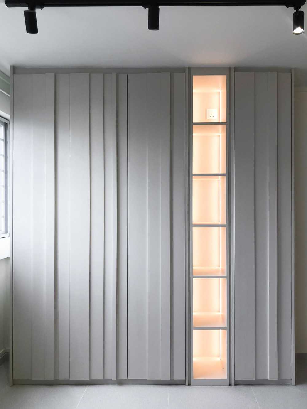 Scandinavian Foyer with Paintings and Storage Cabinets