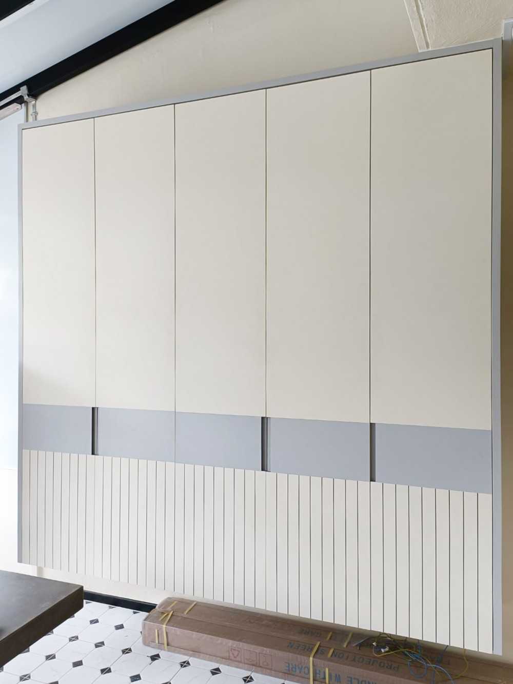 Scandinavian Foyer with Paintings and Storage Cabinets