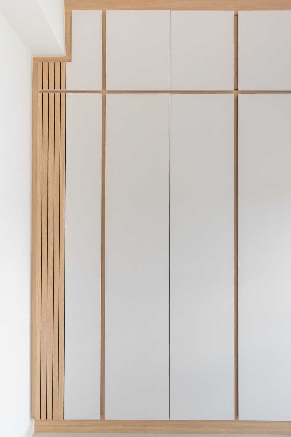 Transitional Bedroom with Feature Wall and Wardrobe