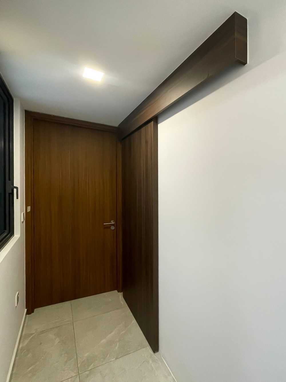Scandinavian Entryway with Window Grille and Paintings