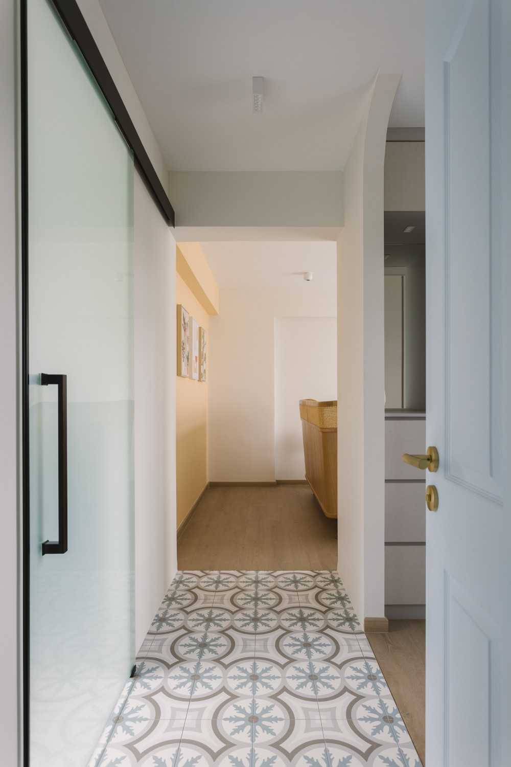 Contemporary Hallway with Artwork and Storage Cabinets