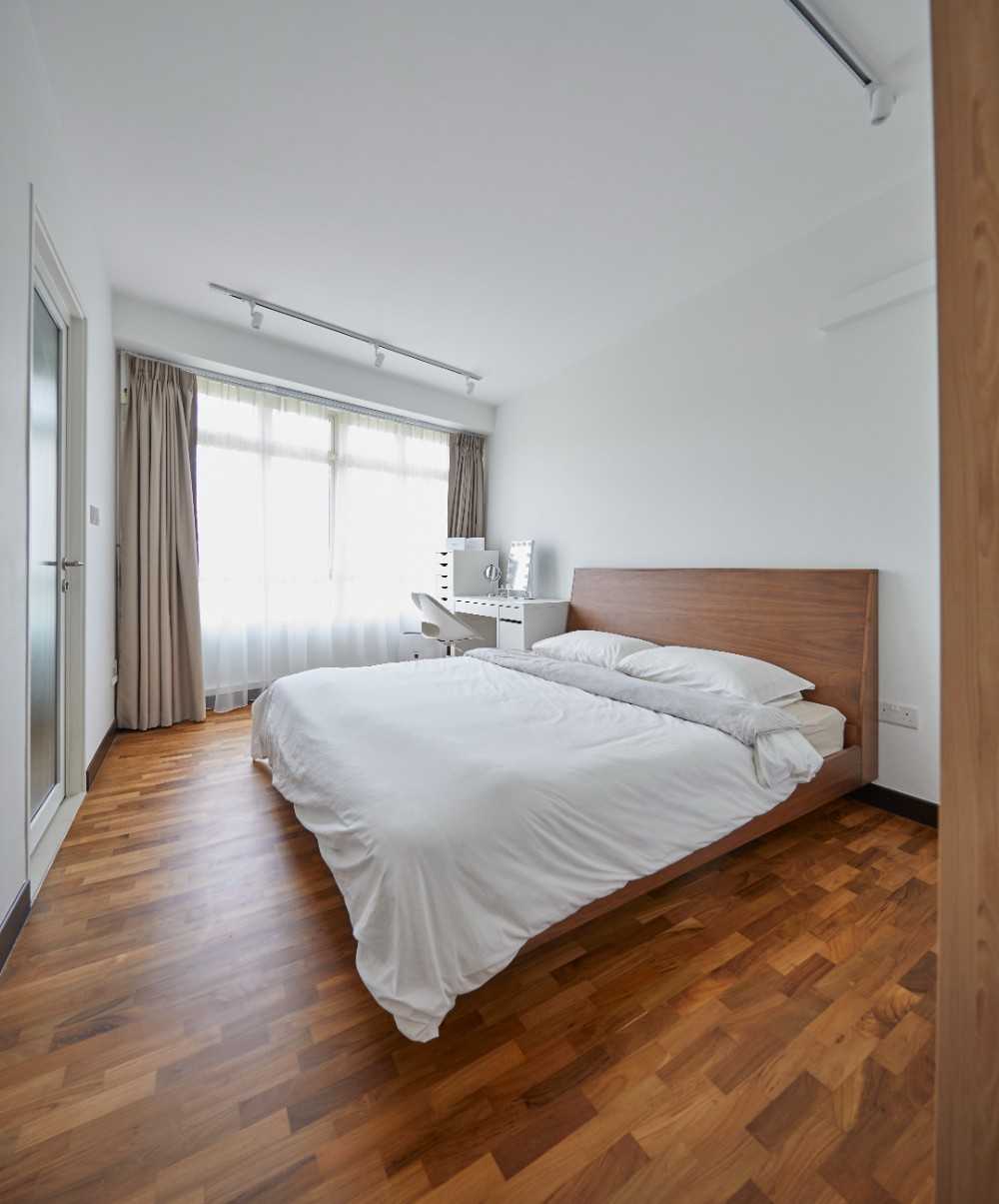 Scandinavian Bedroom with Wood Flooring and Bedside Table