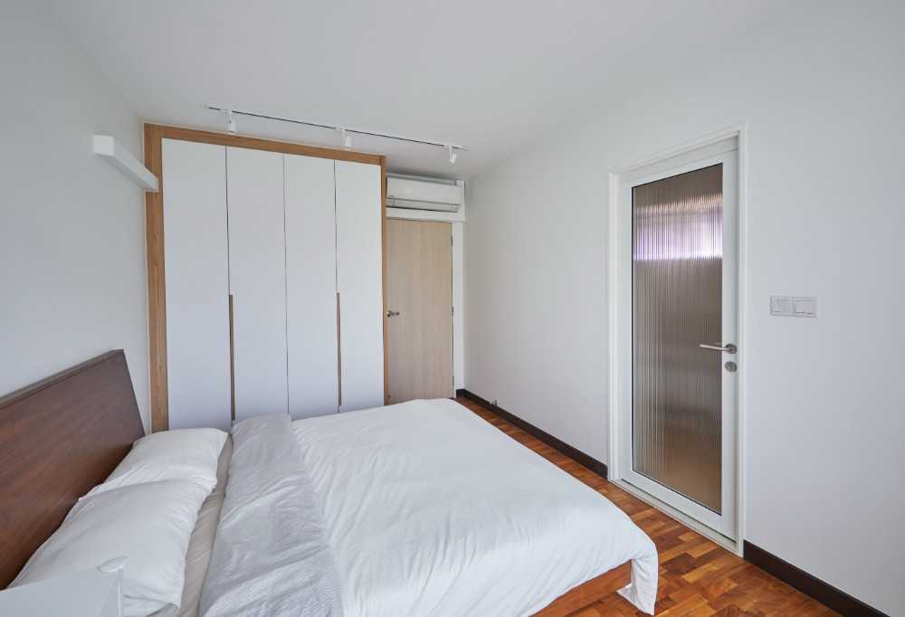 Scandinavian Bedroom with Wood Flooring and Bedroom Dresser