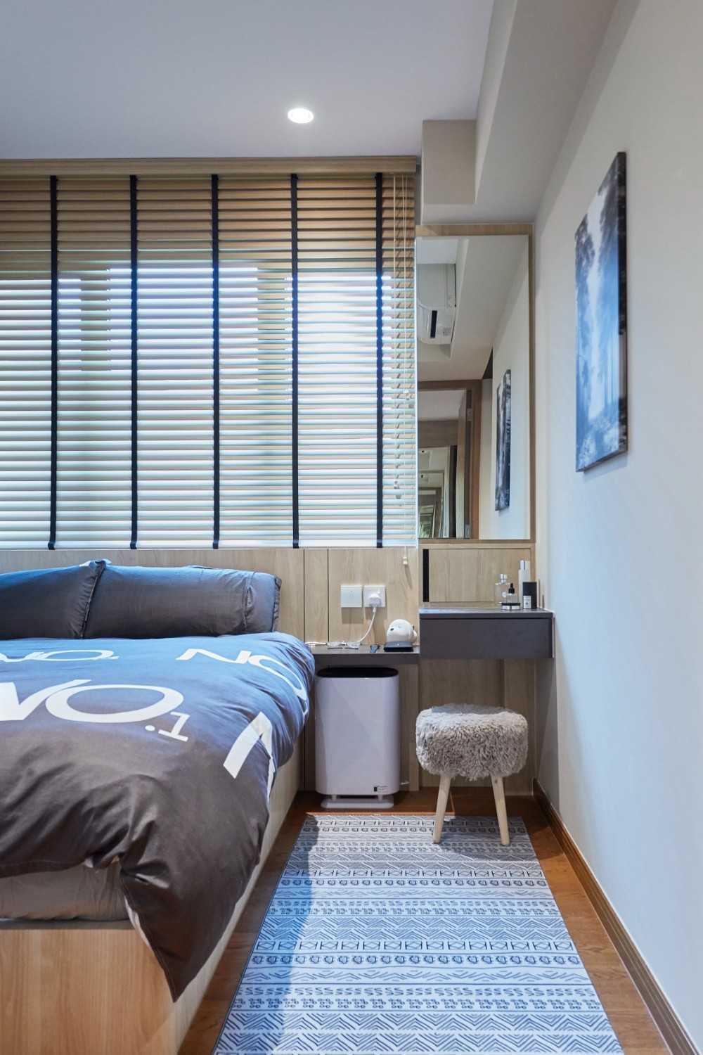 Modern Bedroom with Wood Flooring and Bedside Table