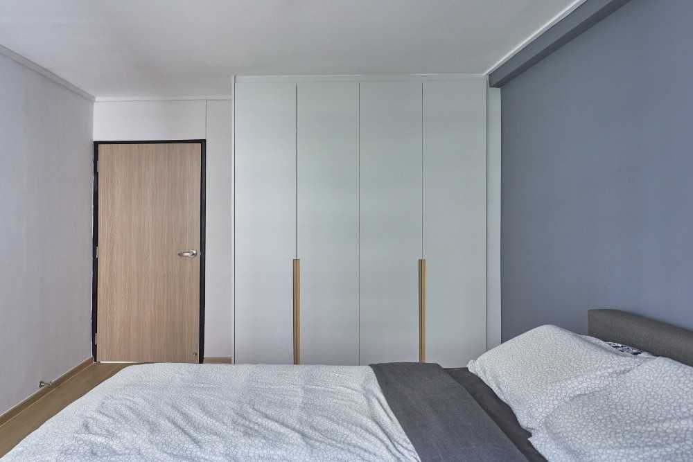 Scandinavian Bedroom with Wood Flooring and Wardrobe