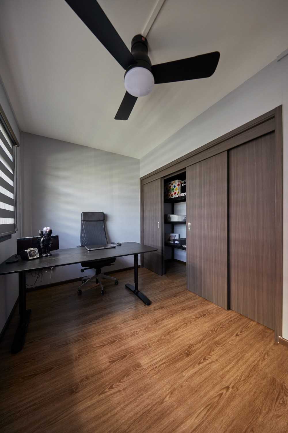 Contemporary Home Office with Bookshelf and Desk Chairs