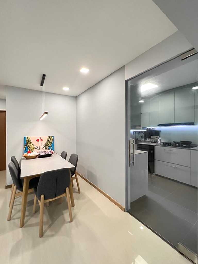 Scandinavian Dining Room with Glass Door and Paintings