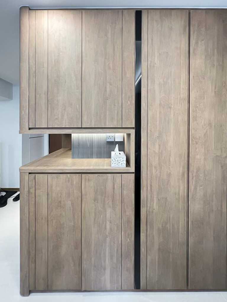 Scandinavian Foyer with Paintings and Storage Cabinets