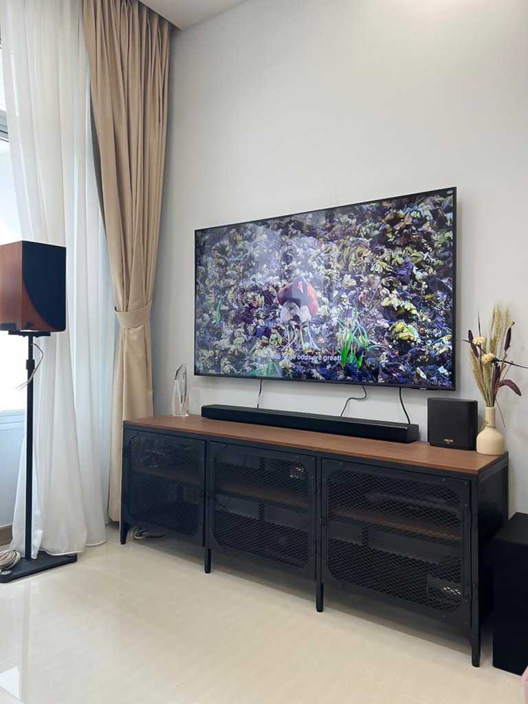 Scandinavian Living Room with TV Console and Paintings