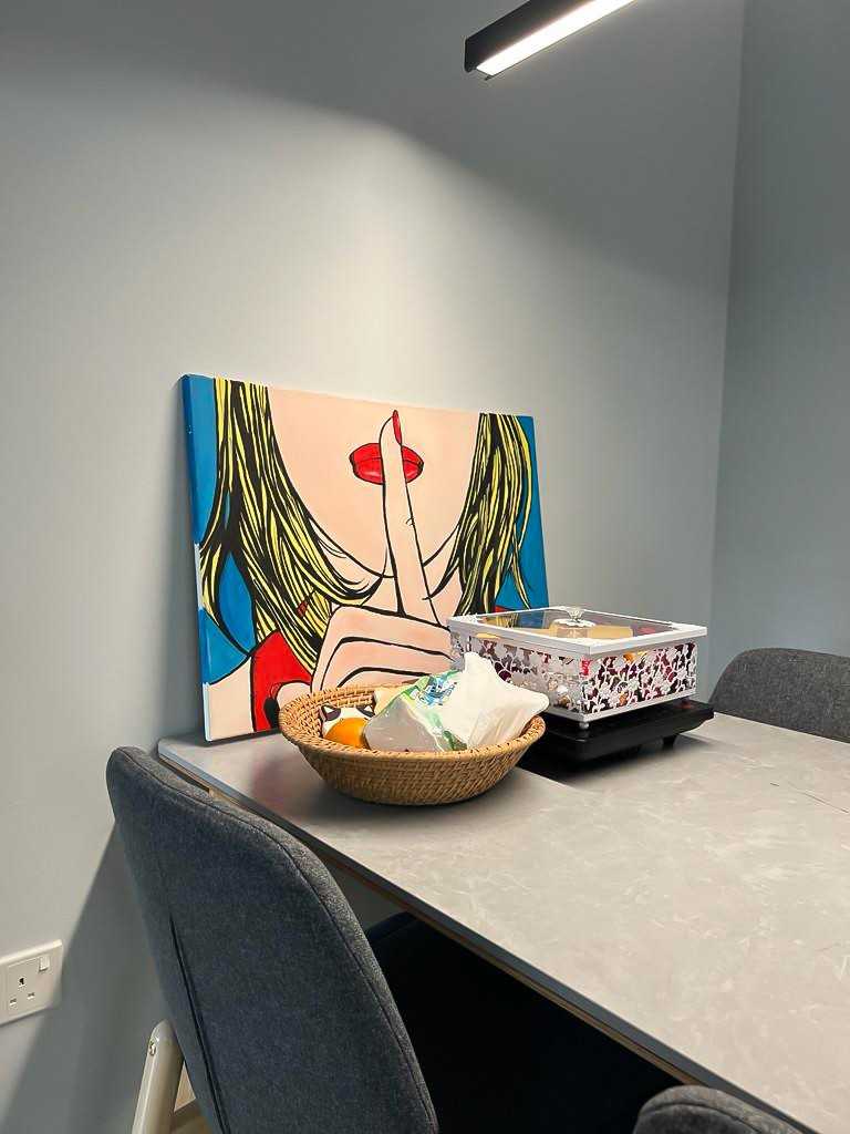 Scandinavian Dining Room with Dining Table and Paintings