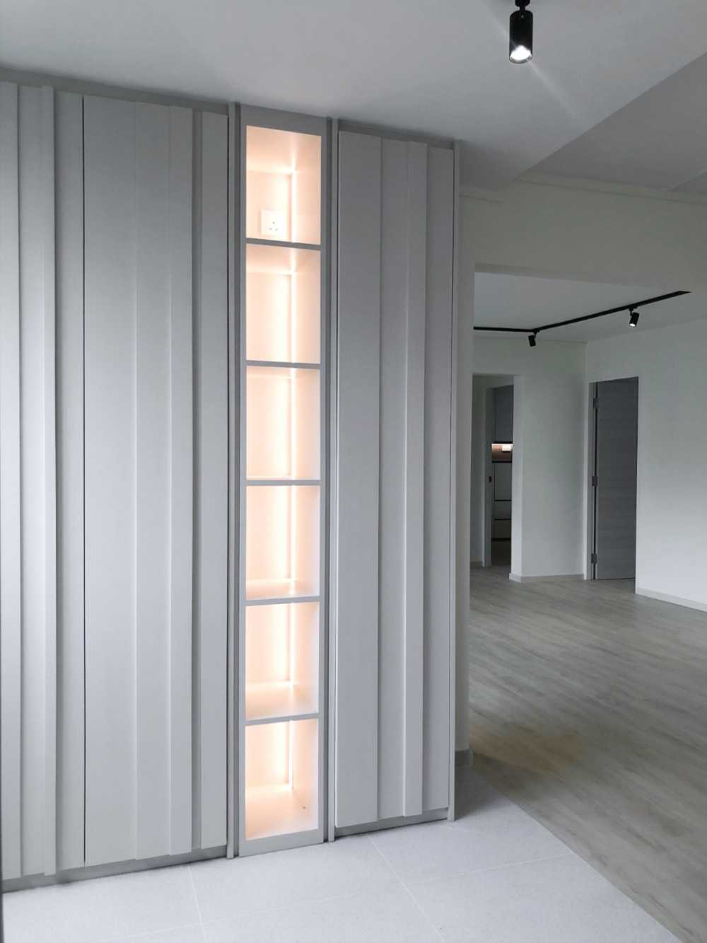 Scandinavian Foyer with Paintings and Storage Cabinets