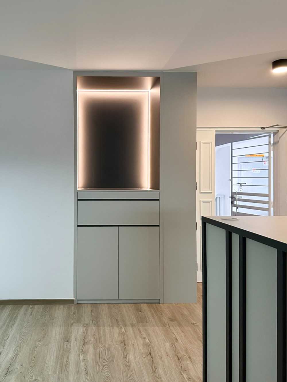 Scandinavian Foyer with Paintings and Storage Cabinets