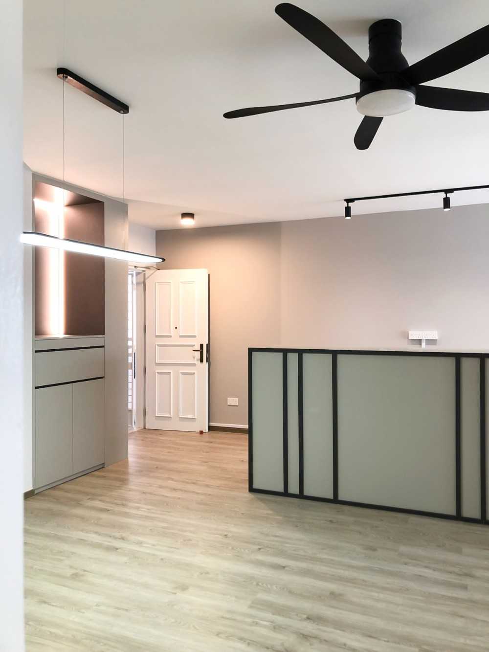 Scandinavian Foyer with Paintings and Storage Cabinets