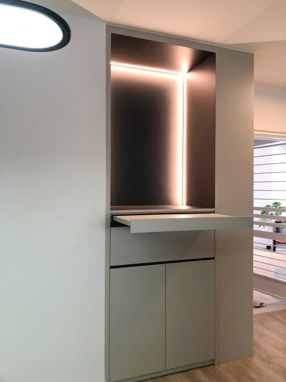Scandinavian Foyer with Paintings and Storage Cabinets