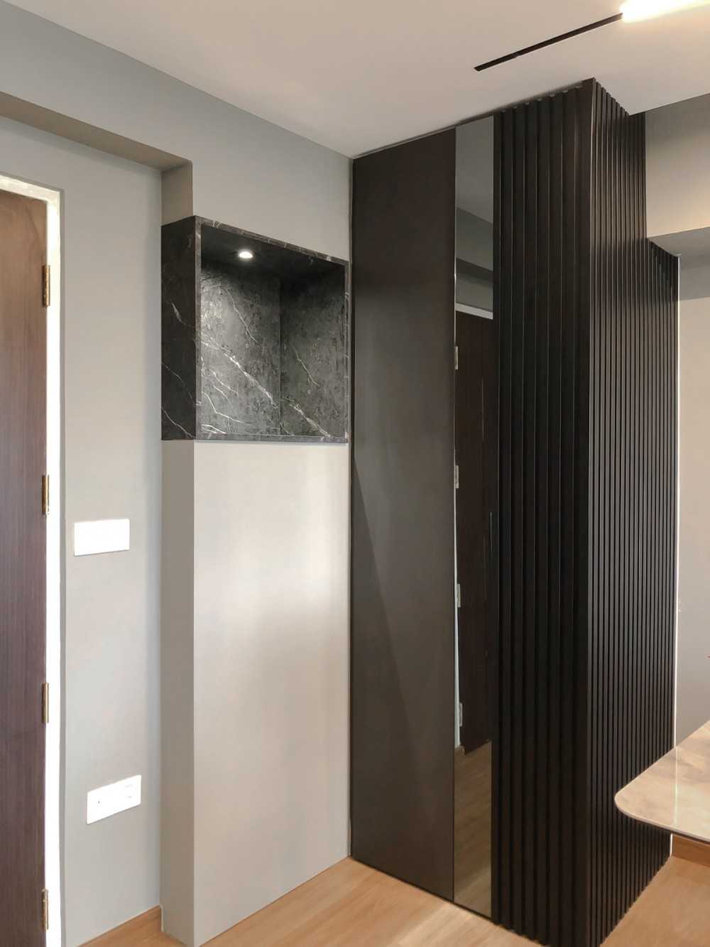 Modern Foyer with Paintings and Storage Cabinets