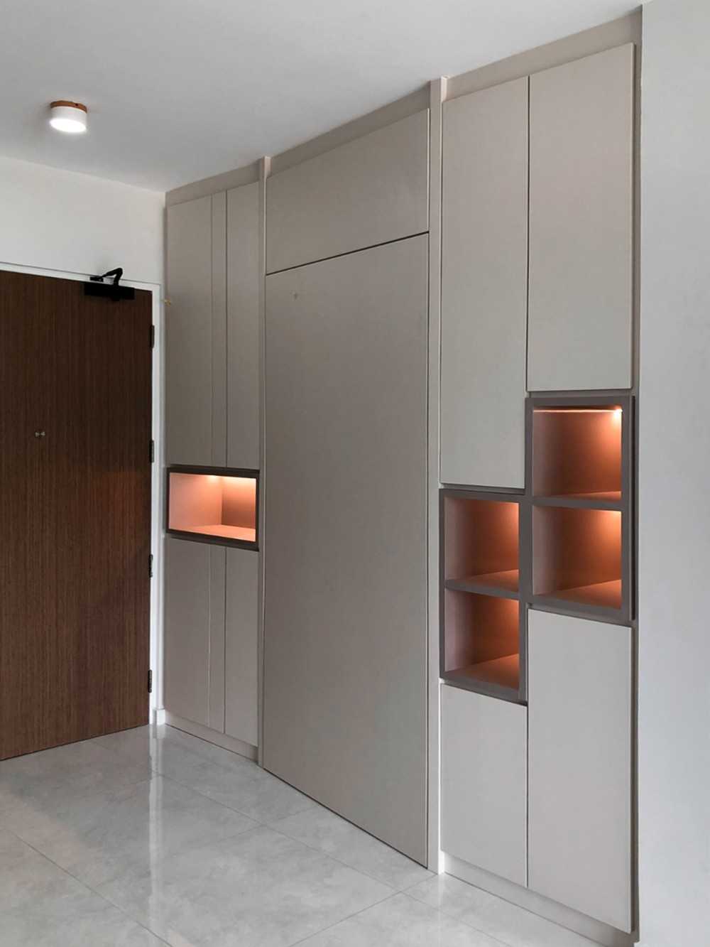 Scandinavian Foyer with Paintings and Storage Cabinets