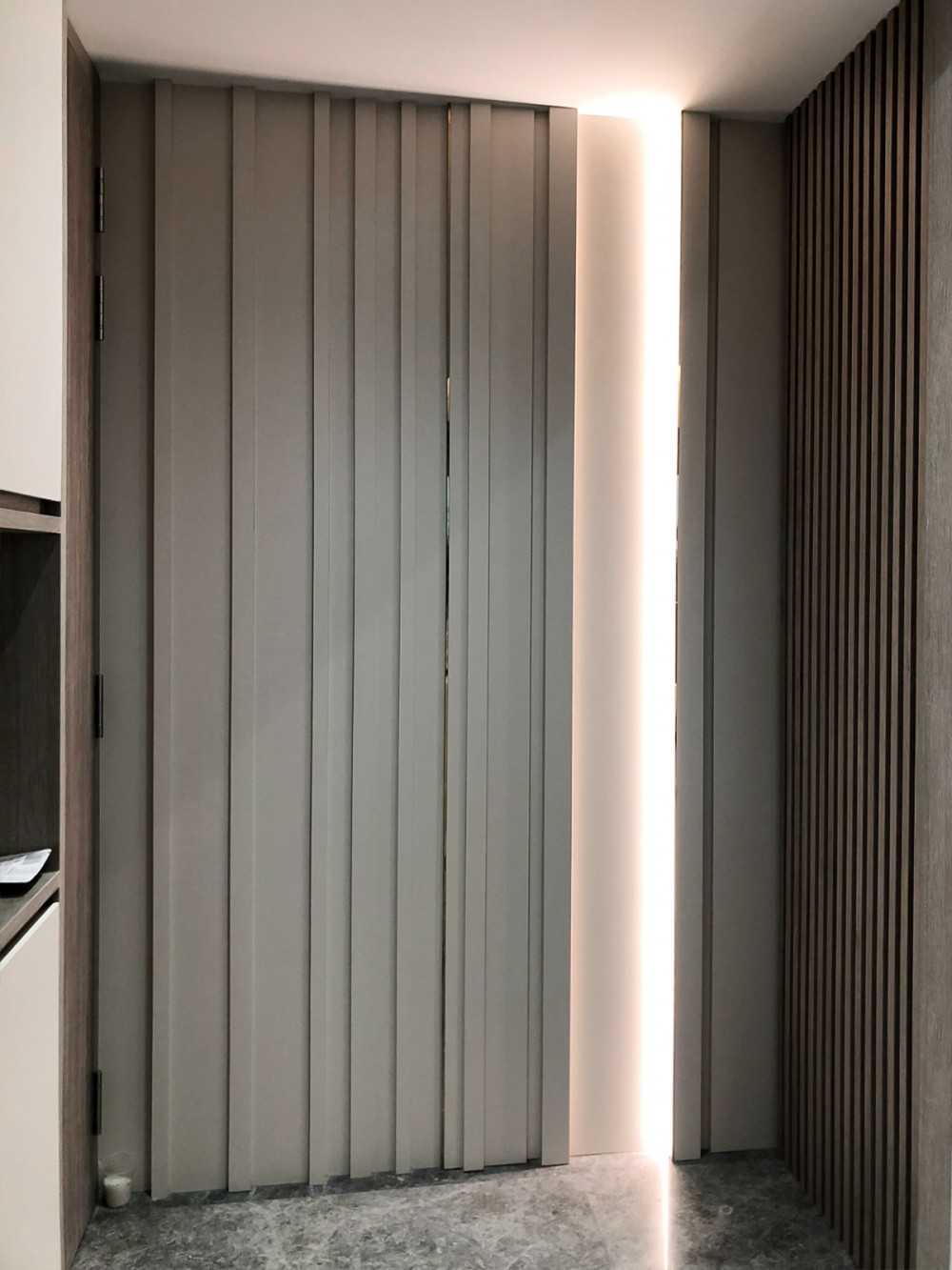 Scandinavian Foyer with Paintings and Display Cabinets