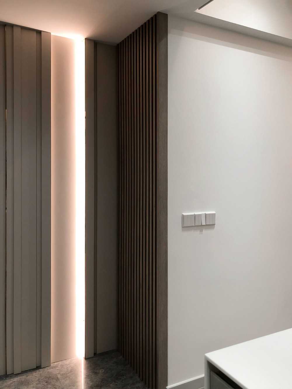 Scandinavian Foyer with Paintings and Shoe Cabinets
