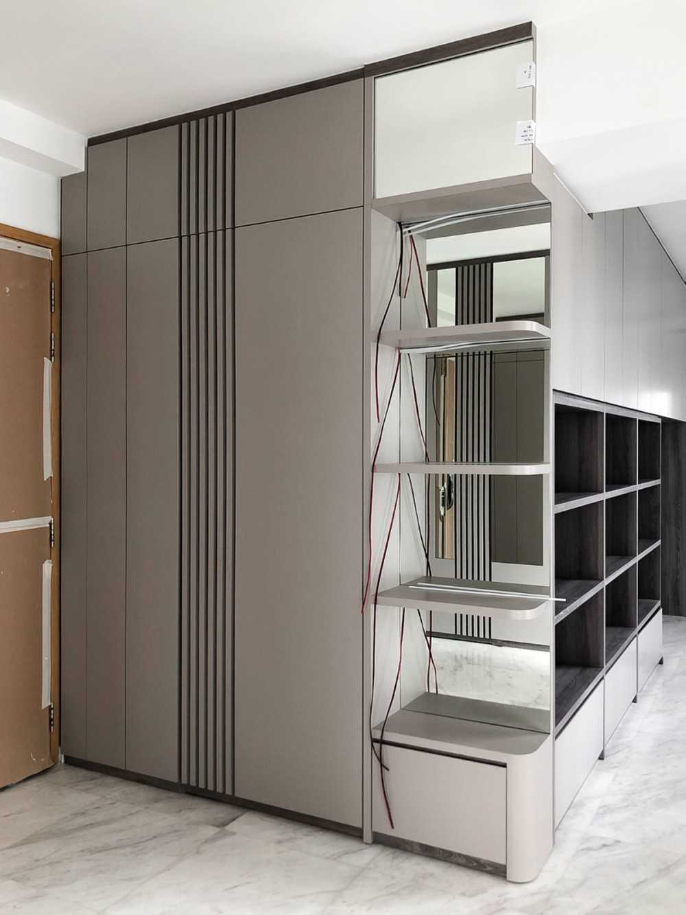 Modern Foyer with Paintings and Storage Cabinets