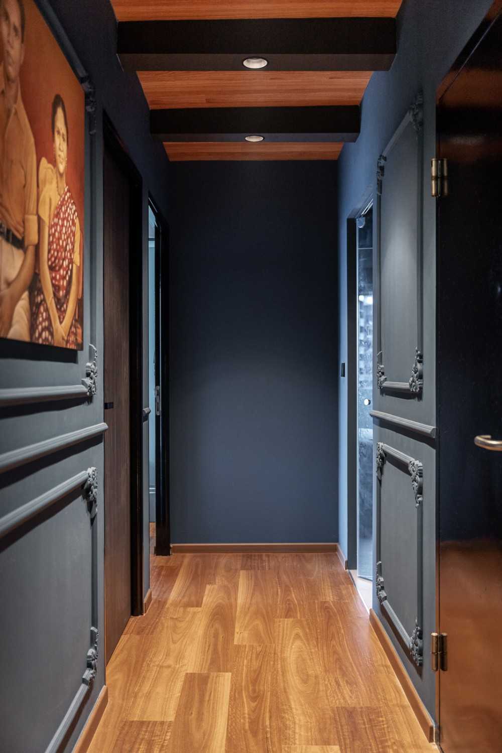 Industrial Hallway with Drop Ceiling and Artwork