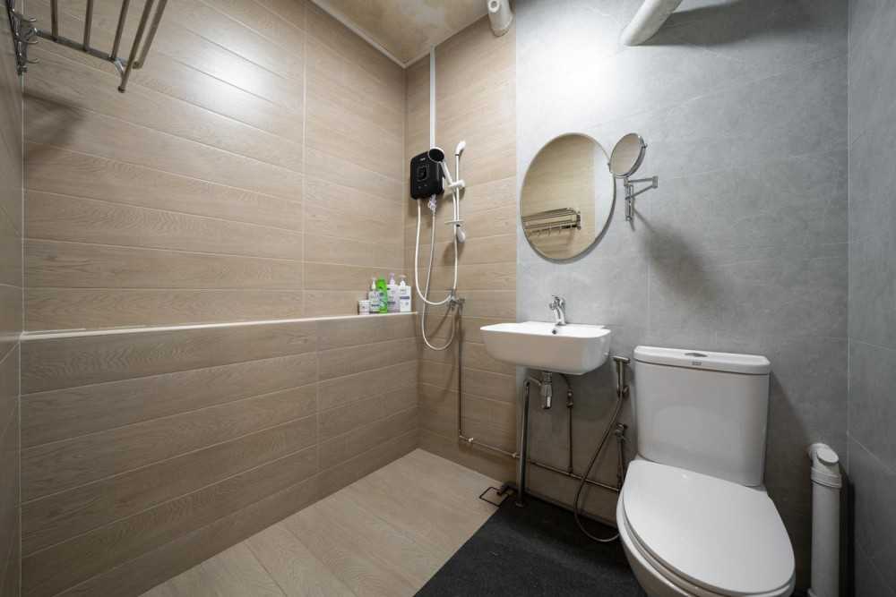 Minimalist Bathroom with Wood Flooring and Mirror