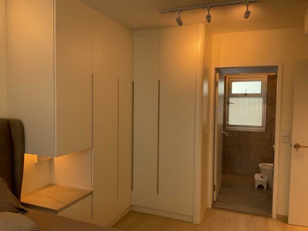 Minimalist Bedroom with Vinyl Flooring and Ceiling Light