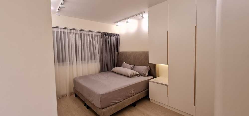 Minimalist Bedroom with Vinyl Flooring and Ceiling Light